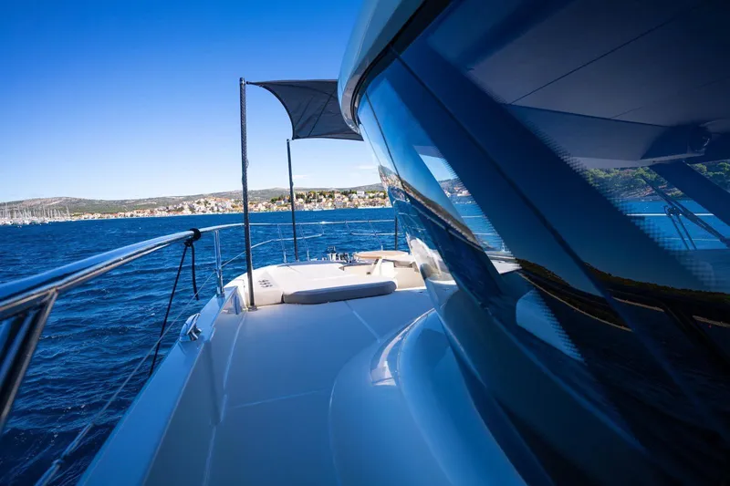 Leena Yacht Photos Pics Luxury Prestige X60 yacht cruising on blue ocean, 2023 model.