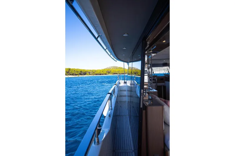 Leena Yacht Photos Pics 2023 Prestige X60 yacht deck with ocean view and modern interior.