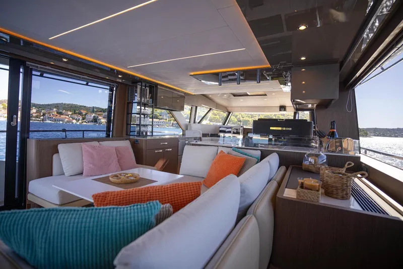 Leena Yacht Photos Pics Luxurious interior of 2023 Prestige X60 yacht with modern design and scenic ocean view.