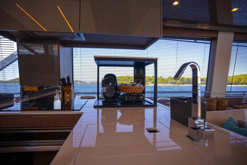 Leena Yacht Photos Pics Modern kitchen interior on 2023 Prestige X60 yacht with sleek design and ocean view.