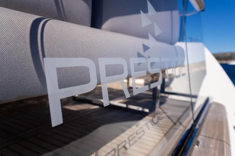 Leena Yacht Photos Pics 2023 Prestige X60 yacht with sleek design and modern glass detailing.