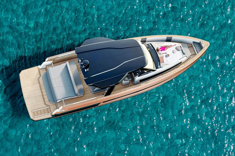  Yacht Photos Pics Aerial view of 2026 Fjord 490 OPEN yacht on clear blue water.