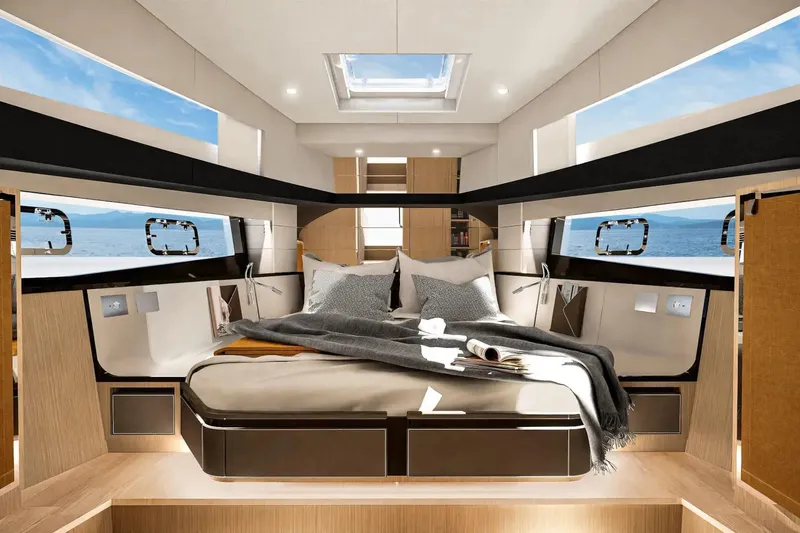  Yacht Photos Pics Luxurious interior of 2026 Fjord 490 OPEN yacht with panoramic windows and cozy bedding.