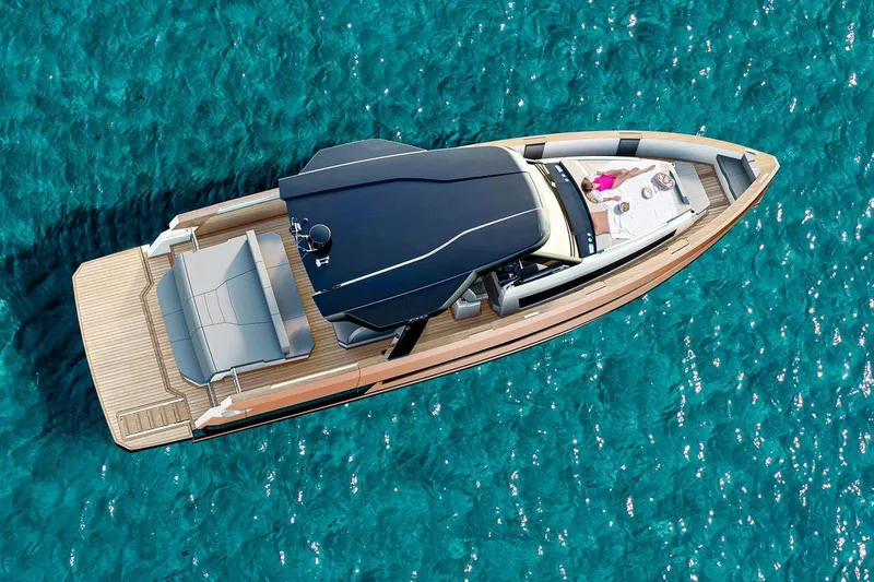  Yacht Photos Pics Aerial view of 2026 Fjord 490 OPEN yacht on clear blue water.