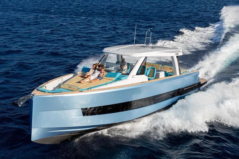  Yacht Photos Pics 2026 Fjord 490 OPEN yacht cruising on open sea with passengers relaxing.