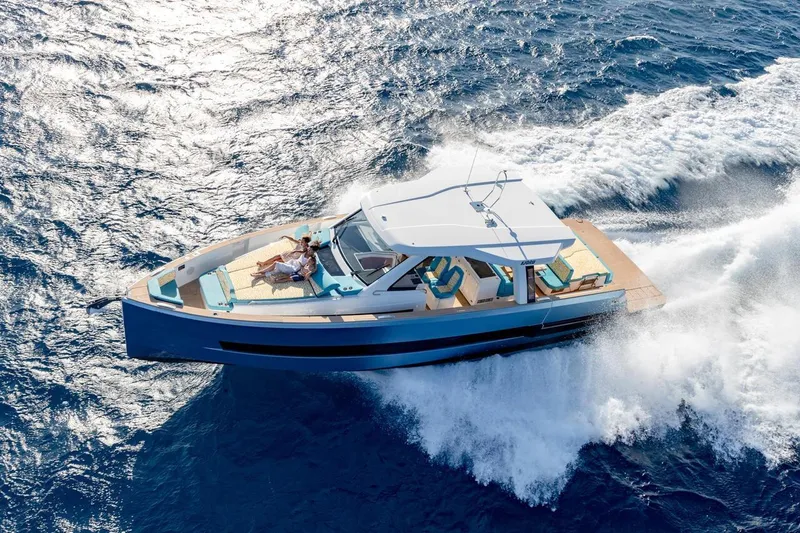  Yacht Photos Pics 2026 Fjord 490 OPEN yacht cruising on open sea, featuring sleek design and luxury amenities.