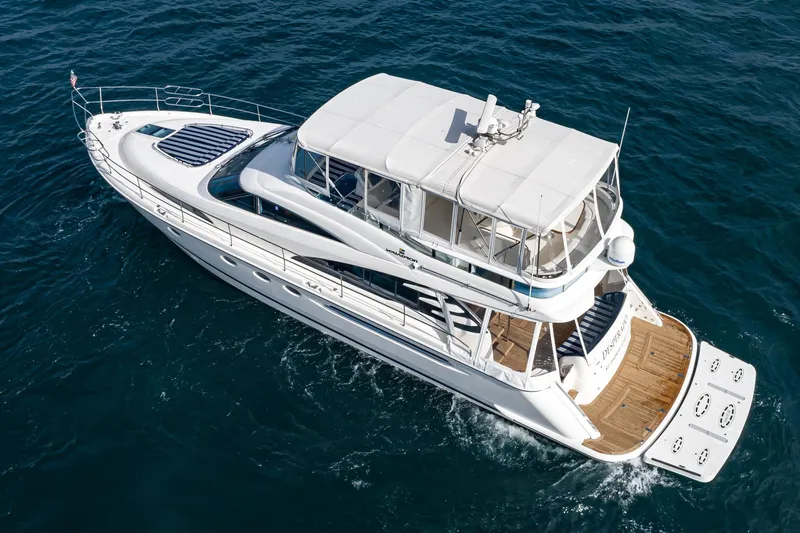 Desperado Yacht Photos Pics 2002 Fairline Squadron 58 yacht cruising on open water, aerial view.