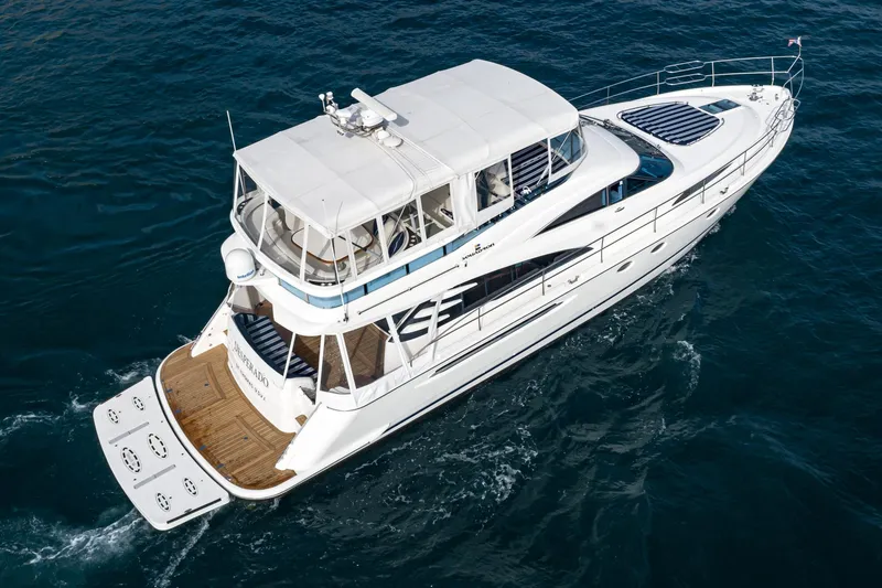 Desperado Yacht Photos Pics 2002 Fairline Squadron 58 yacht cruising on open water.