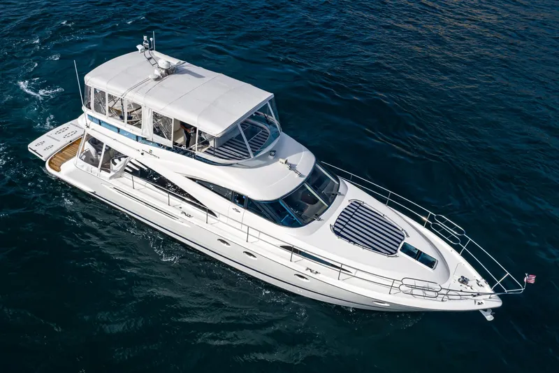 Desperado Yacht Photos Pics Luxury 2002 Fairline Squadron 58 yacht cruising on open water.