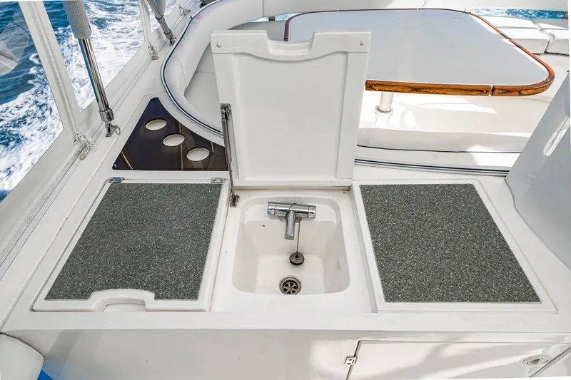 Desperado Yacht Photos Pics Outdoor sink area on 2002 Fairline Squadron 58 yacht, featuring a compact design.
