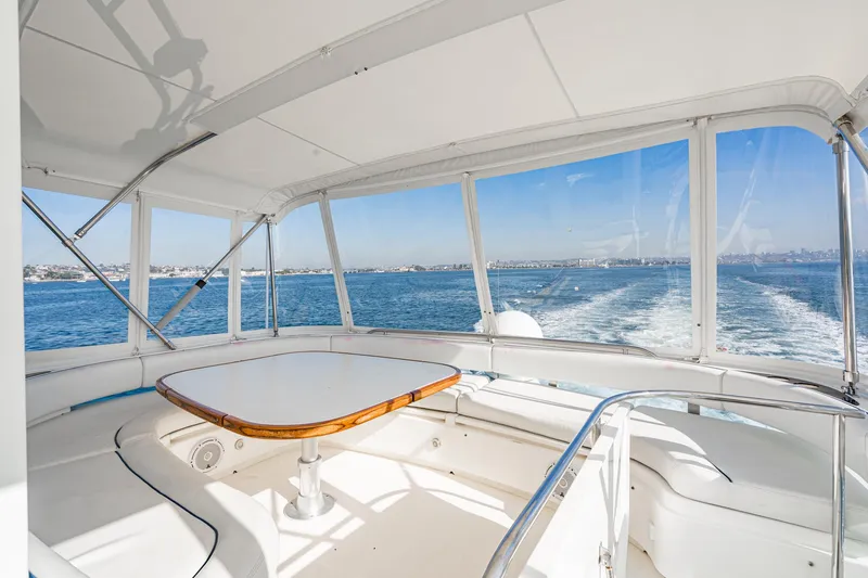 Desperado Yacht Photos Pics 2002 Fairline Squadron 58 yacht interior with ocean view and seating area.