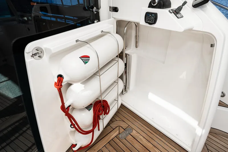 Desperado Yacht Photos Pics Storage compartment with life buoys on a 2002 Fairline Squadron 58 yacht.