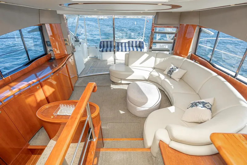 Desperado Yacht Photos Pics Luxurious interior of 2002 Fairline Squadron 58 yacht with elegant seating and ocean view.