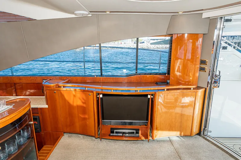 Desperado Yacht Photos Pics Luxurious interior of 2002 Fairline Squadron 58 yacht with wood finish and ocean view.