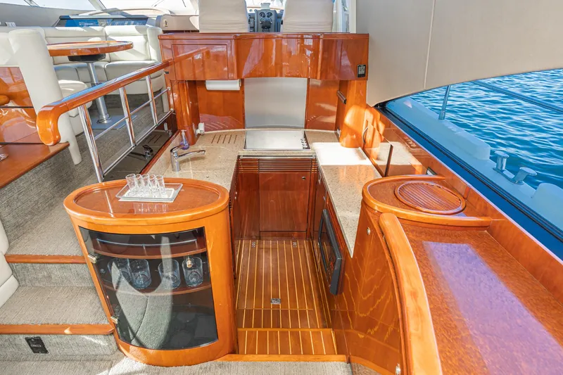 Desperado Yacht Photos Pics Luxurious interior of 2002 Fairline Squadron 58 yacht with polished wood finishes.