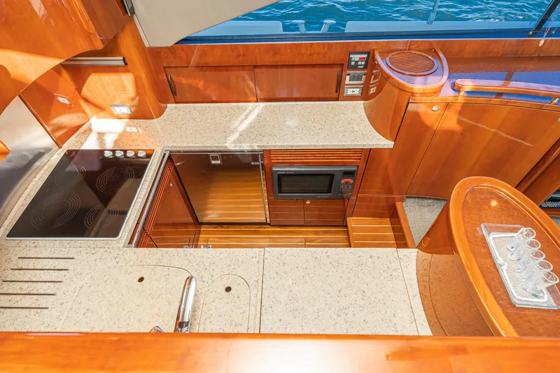 Desperado Yacht Photos Pics Luxurious kitchen interior of 2002 Fairline Squadron 58 yacht with modern appliances.