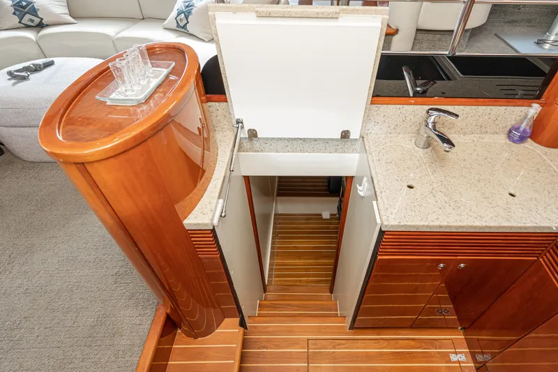 Desperado Yacht Photos Pics Luxurious 2002 Fairline Squadron 58 yacht interior with elegant wood cabinetry and modern sink.