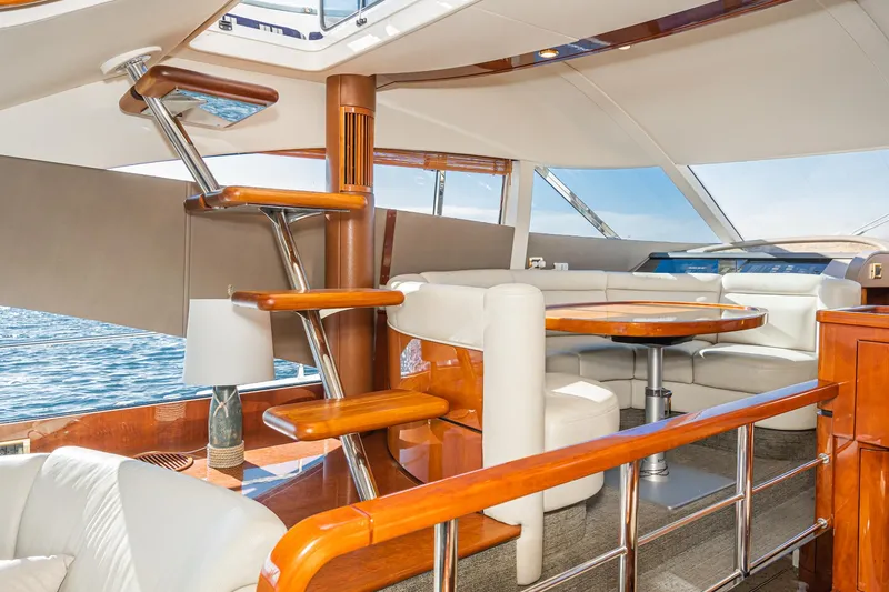 Desperado Yacht Photos Pics Luxurious interior of 2002 Fairline Squadron 58 yacht with elegant wood finishes.