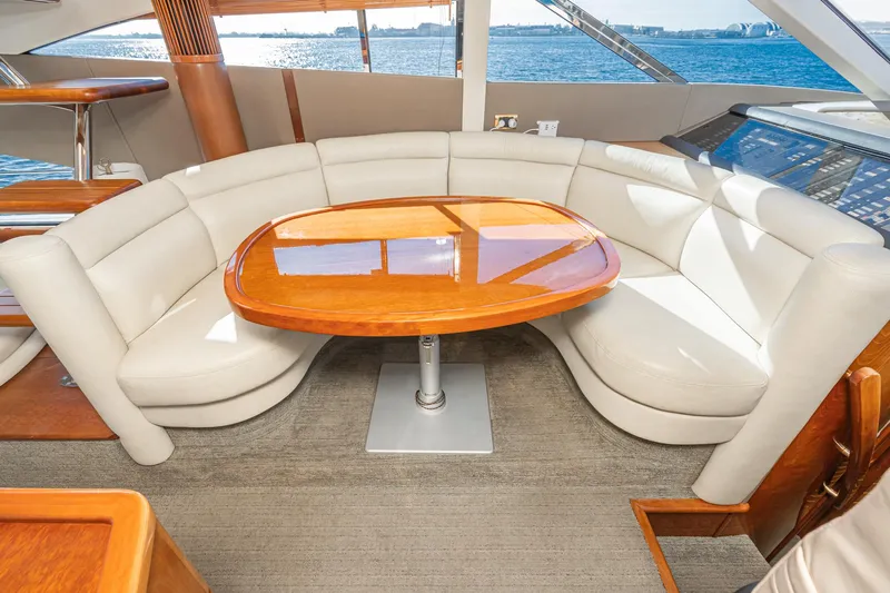 Desperado Yacht Photos Pics Luxurious 2002 Fairline Squadron 58 yacht interior with elegant seating and wooden table.