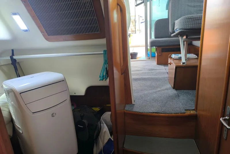  Yacht Photos Pics Interior of 2009 Jeanneau Merry Fischer 925 boat, featuring seating and storage areas.