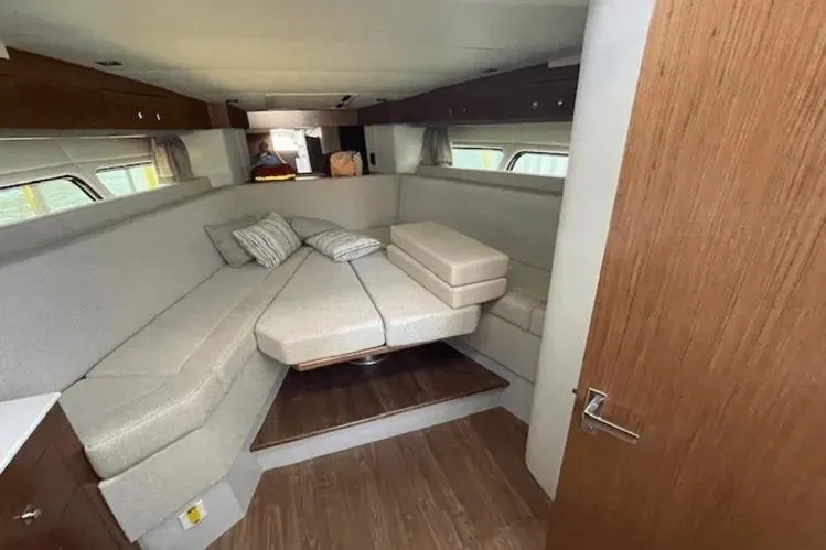  Yacht Photos Pics 2018 Cruisers Yachts 390 Express Coupe interior with cozy seating and modern design.