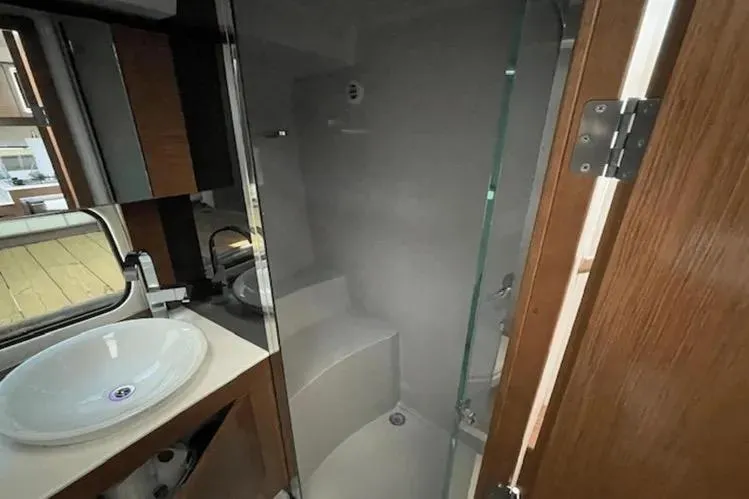  Yacht Photos Pics 2018 Cruisers Yachts 390 Express Coupe bathroom with modern fixtures and glass shower.