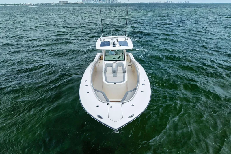 Prime Tyme Yacht Photos Pics 2020 Scout 355 LXF boat on open water, showcasing sleek design and spacious deck.