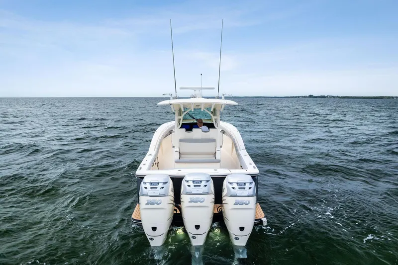 Prime Tyme Yacht Photos Pics 2020 Scout 355 LXF boat with triple engines cruising on open water.