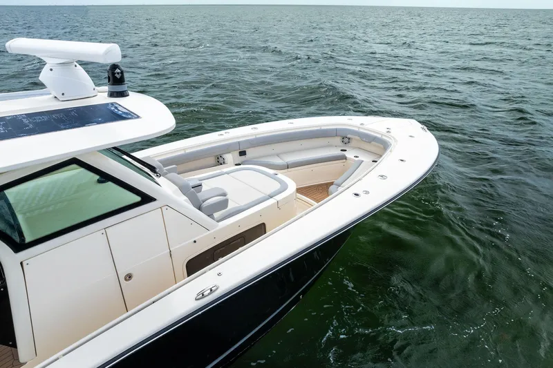 Prime Tyme Yacht Photos Pics 2020 Scout 355 LXF boat on open water, showcasing sleek design and spacious seating.