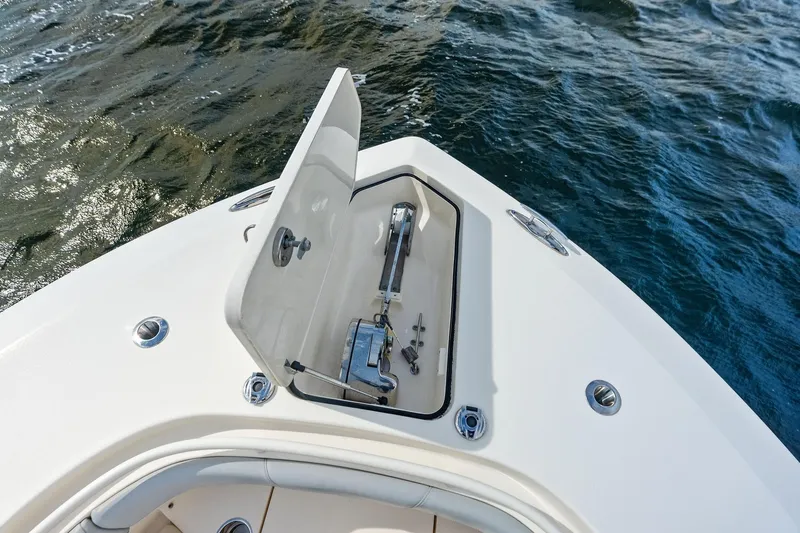 Prime Tyme Yacht Photos Pics 2020 Scout 355 LXF boat anchor compartment open on calm water.