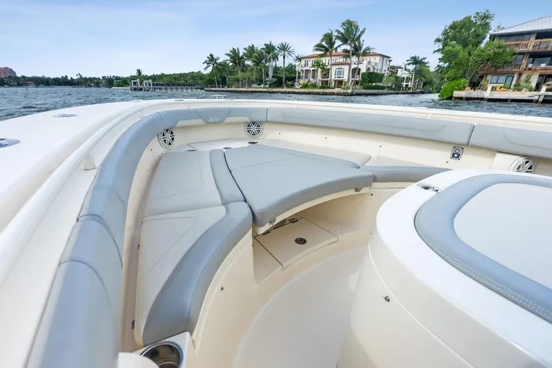Prime Tyme Yacht Photos Pics 2020 Scout 355 LXF boat interior with luxurious seating and waterfront view.