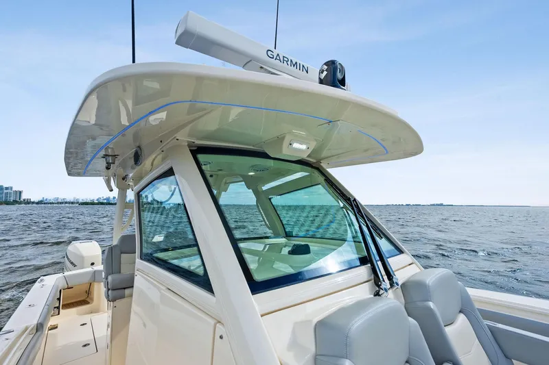 Prime Tyme Yacht Photos Pics 2020 Scout 355 LXF boat on water, featuring Garmin equipment and sleek design.