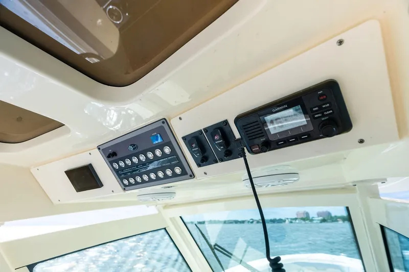 Prime Tyme Yacht Photos Pics 2020 Scout 355 LXF boat dashboard with Garmin navigation system and control panel.