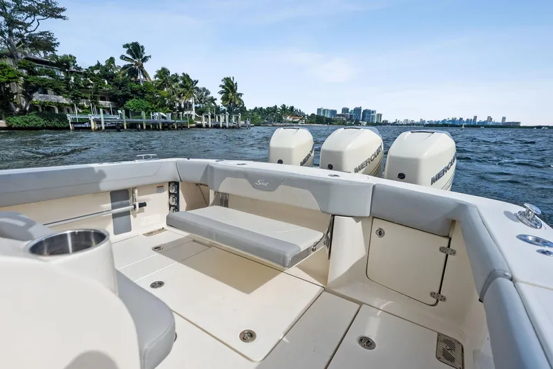 Prime Tyme Yacht Photos Pics 2020 Scout 355 LXF boat with triple Mercury engines on a scenic waterway.