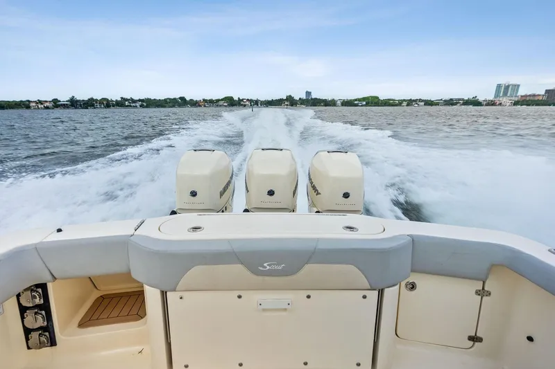 Prime Tyme Yacht Photos Pics 2020 Scout 355 LXF boat with triple engines cruising on open water.