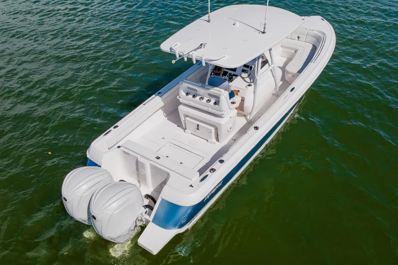  Yacht Photos Pics 2018 Intrepid 327 Center Console boat on water, featuring dual outboard engines.