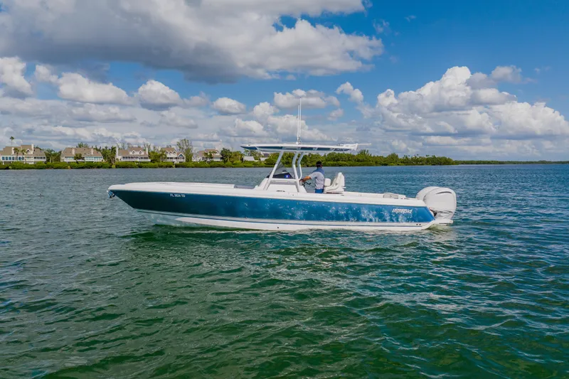  Yacht Photos Pics 2018 Intrepid 327 Center Console boat cruising on a sunny day.
