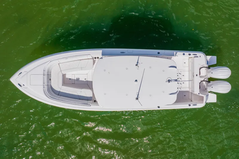  Yacht Photos Pics Overhead view of 2018 Intrepid 327 Center Console boat on green water.
