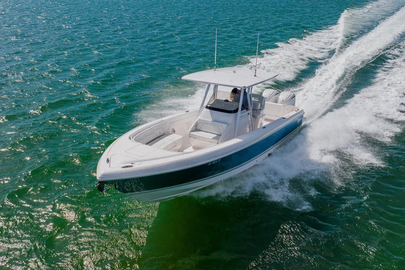  Yacht Photos Pics 2018 Intrepid 327 Center Console boat cruising on open water.