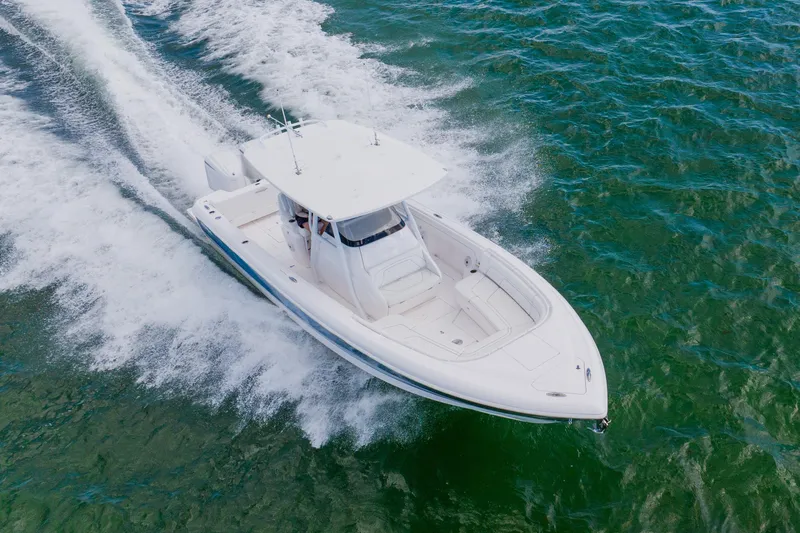  Yacht Photos Pics 2018 Intrepid 327 Center Console boat cruising on open water.