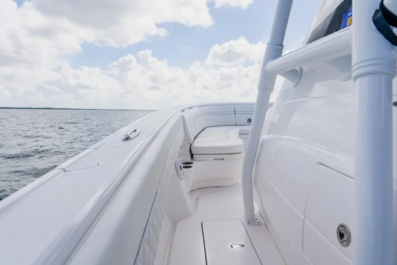  Yacht Photos Pics 2018 Intrepid 327 Center Console boat on open water under a cloudy sky.