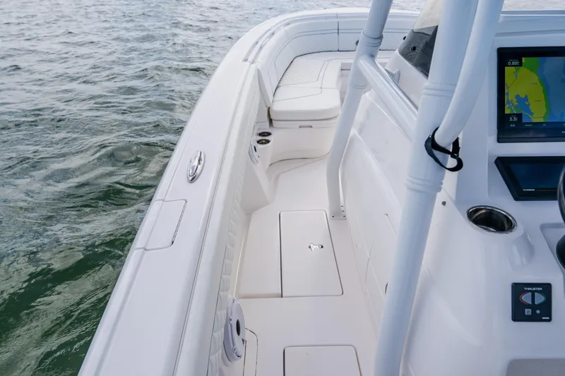  Yacht Photos Pics 2018 Intrepid 327 Center Console boat interior with navigation display, on calm water.