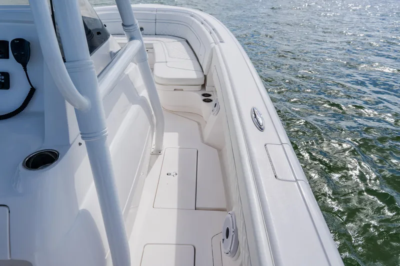  Yacht Photos Pics 2018 Intrepid 327 Center Console boat on water, showcasing sleek design and spacious deck.
