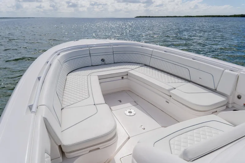  Yacht Photos Pics 2018 Intrepid 327 Center Console boat with spacious seating on calm waters.