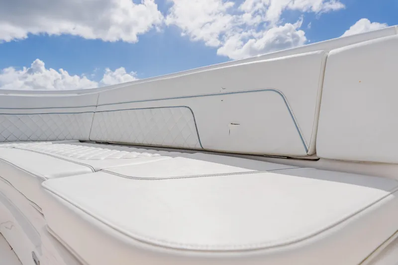  Yacht Photos Pics 2018 Intrepid 327 Center Console boat seating under a bright blue sky.