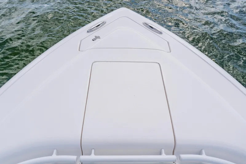  Yacht Photos Pics Bow of a 2018 Intrepid 327 Center Console boat on water.