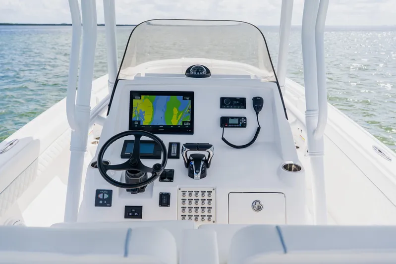  Yacht Photos Pics 2018 Intrepid 327 Center Console boat dashboard with navigation system and steering wheel.