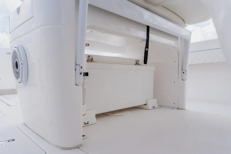  Yacht Photos Pics 2018 Intrepid 327 Center Console storage compartment with speaker detail.