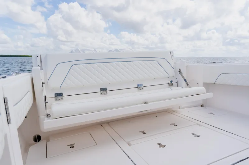  Yacht Photos Pics 2018 Intrepid 327 Center Console boat with white seating and ocean backdrop.