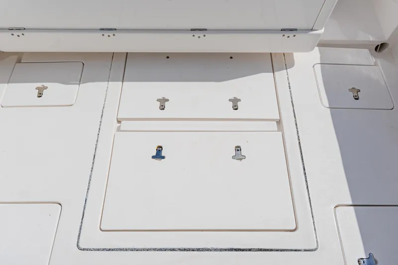  Yacht Photos Pics 2018 Intrepid 327 Center Console deck with storage compartments and latches.